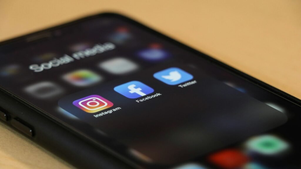 Smartphone showing search, social media and email apps