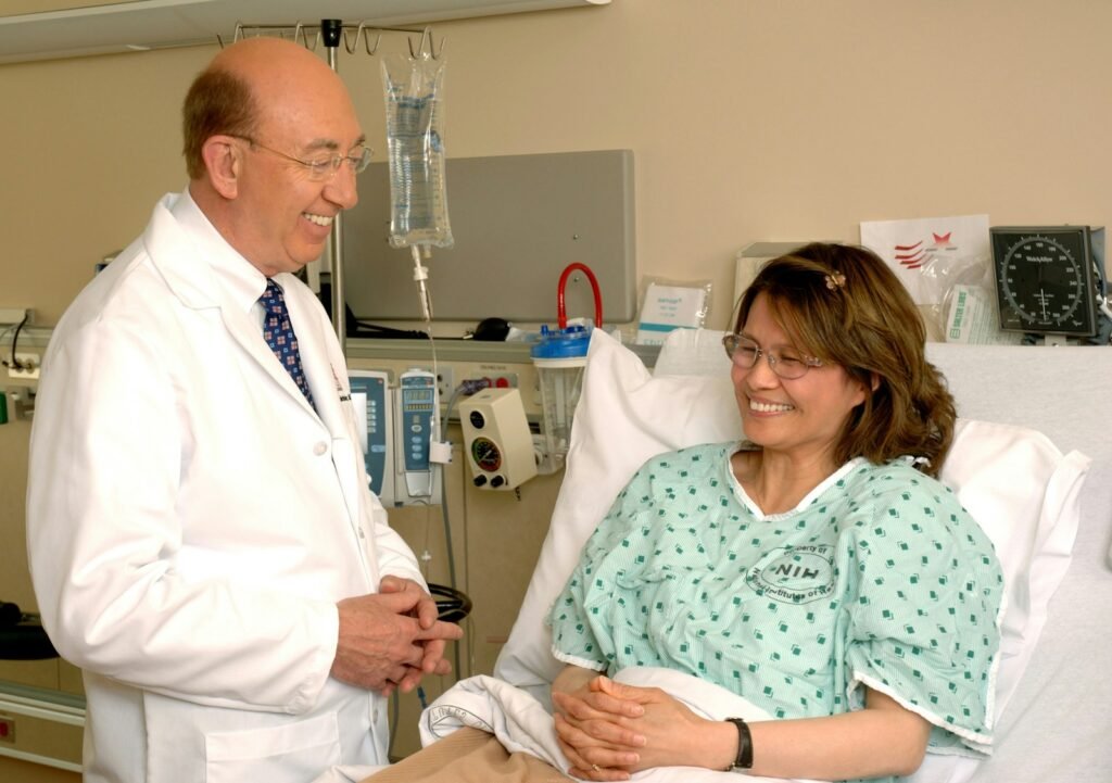 Doctor speaking with a patient in a hospital consultation room
