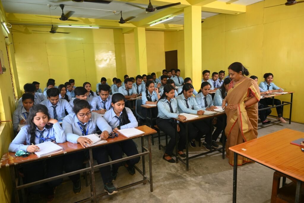A classroom full of students sitting at desks