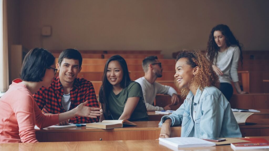 Students attending a class in a college classroom