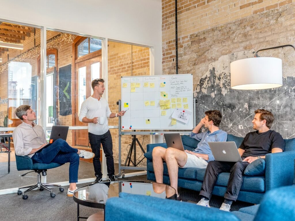 Startup team watching a whiteboard presentation