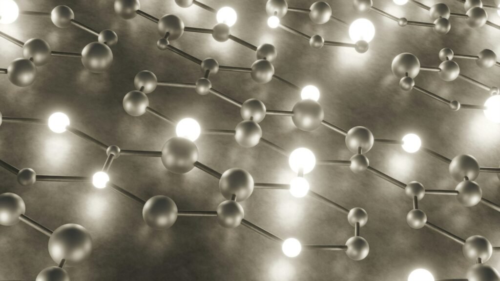 A network of connected glowing spheres on a dark surface