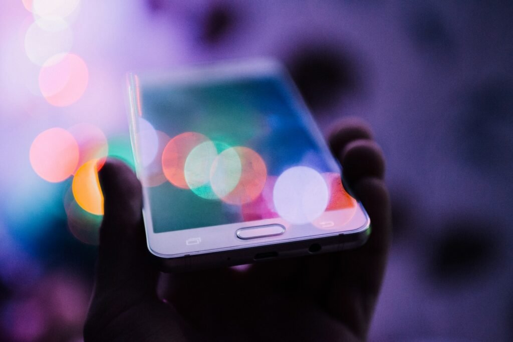 A person holding a smartphone in their hand