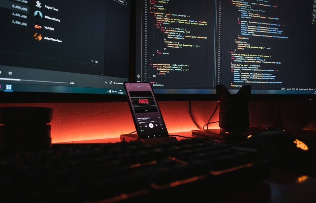 Computer monitors showing website code